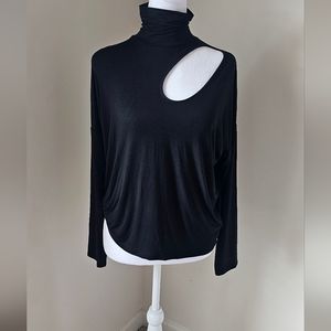 Women's black turtle neck cut out on the front of blouse. Women's black turtle n